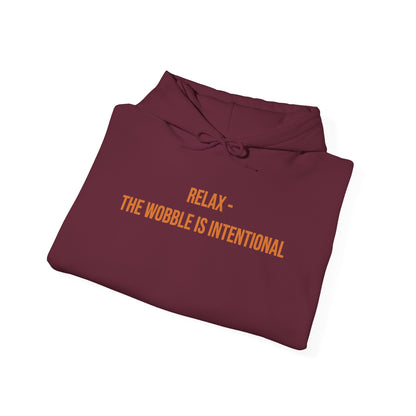 "Relax — The Wobble Is Intentional" Unisex Hoodie — Bold Gold Lettering | Uplifted By Design™ Cerebral Palsy & Adaptive Movement Hoodie