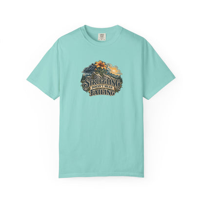 "Struggling Doesn't Mean Failing" Illustrated Edition Unisex T-Shirt — Vintage Wildflower & Clearing-Storm Illustration | Uplifted By Design™ Mental Health & Emotional Wellbeing Tee
