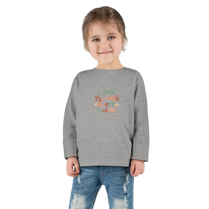 "Loved Through Every Feeling" Toddler Long Sleeve Tee — Groovy Sparkle Lettering | Uplifted By Design™ Inspirational Kids Shirt