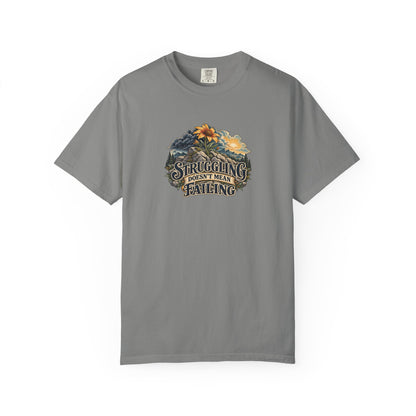 "Struggling Doesn't Mean Failing" Illustrated Edition Unisex T-Shirt — Vintage Wildflower & Clearing-Storm Illustration | Uplifted By Design™ Mental Health & Emotional Wellbeing Tee