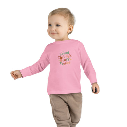 "Loved Through Every Feeling" Toddler Long Sleeve Tee — Groovy Sparkle Lettering | Uplifted By Design™ Inspirational Kids Shirt