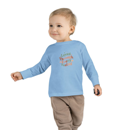 "Loved Through Every Feeling" Toddler Long Sleeve Tee — Groovy Sparkle Lettering | Uplifted By Design™ Inspirational Kids Shirt
